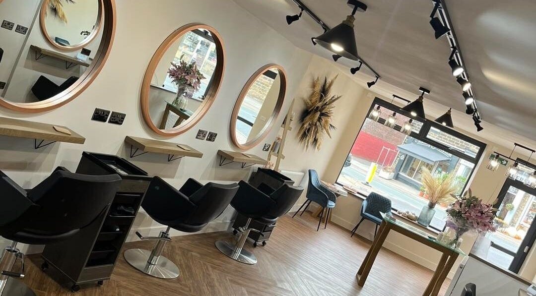 Modern salon interior with chic decor at Hair By HM at Chique, Mapplewell, England, GB.