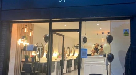 Elegant exterior of Aesthetica Nails & Aesthetics in Iver, England, GB, warmly lit and inviting.