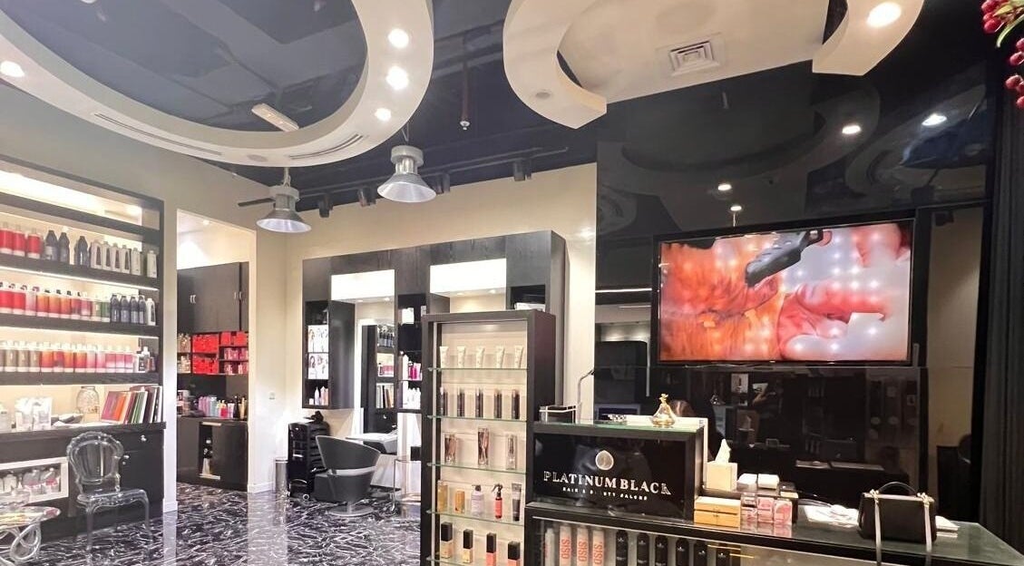 Chic interior of Platinum Black Ladies Salon in Dubai, AE, showcasing luxury hair and beauty products.