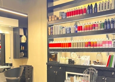 Shelf of premium beauty products at Platinum Black Ladies Salon in Dubai, AE.