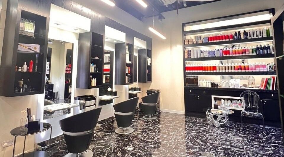 Interior of Platinum Black Ladies Salon in Dubai, AE featuring modern design and stylish black furnishings.