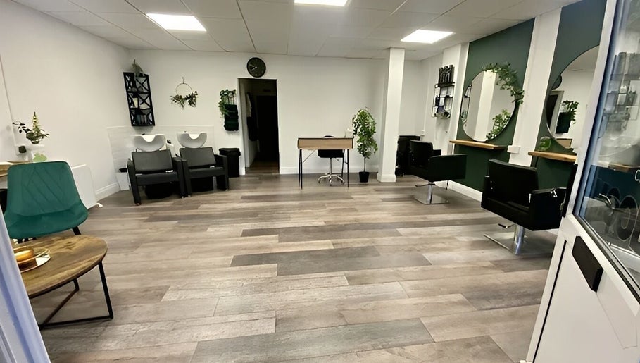 Modern interior of SalonNo7, Barry, Cymru, GB, featuring stylish chairs, mirrors, and greenery decor.