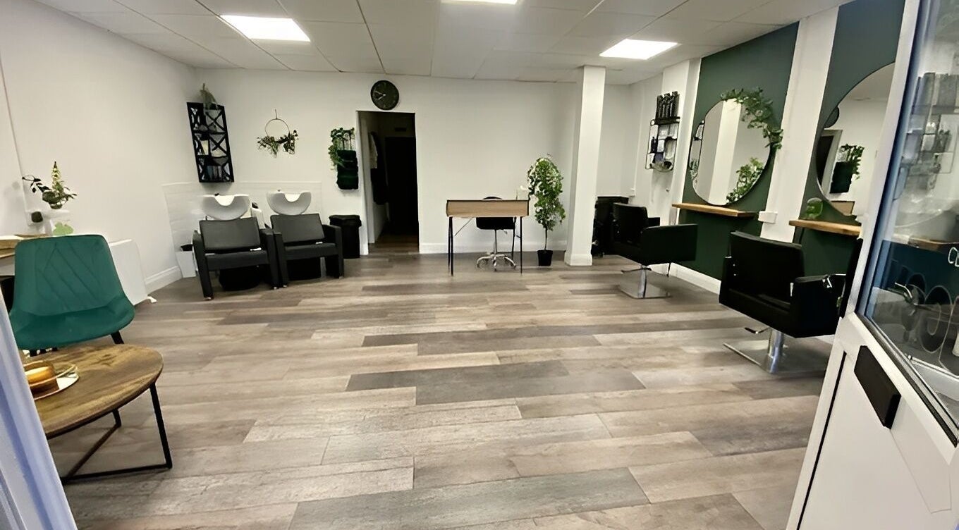 Modern interior of SalonNo7, Barry, Cymru, GB, featuring stylish chairs, mirrors, and greenery decor.