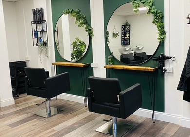 Modern salon interior at SalonNo7, Barry, Cymru, GB, featuring stylish mirrors and chic decor.