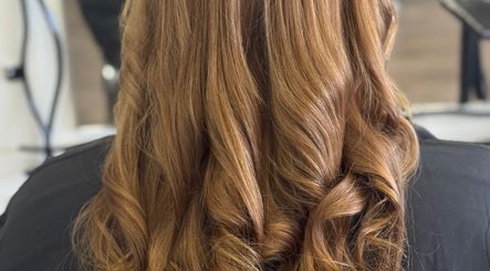 Stunning golden curls at Friel Good Hair, Glasgow, Scotland, GB showcasing hairstyling excellence.