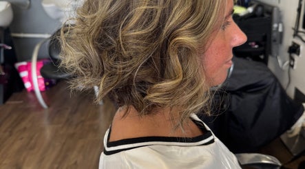 Stylish short curled hairstyle at Friel Good Hair, Glasgow, Scotland, GB.