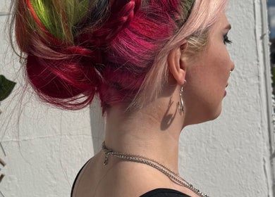 Brightly colored braided hairstyle at Friel Good Hair, located in Glasgow, Scotland, GB.