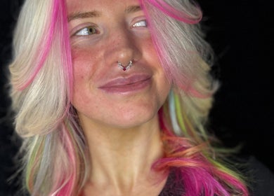 Colorful hair with pink and green highlights at Friel Good Hair, Glasgow, Scotland, GB.