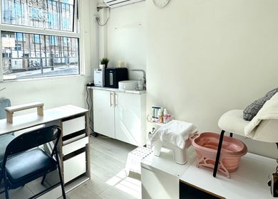 Bright, minimalistic beauty space at Miche in London, England, GB, with a cozy setup for wellness services.