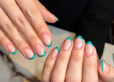 Stylish teal French tip manicure at Miche, London, England, GB.
