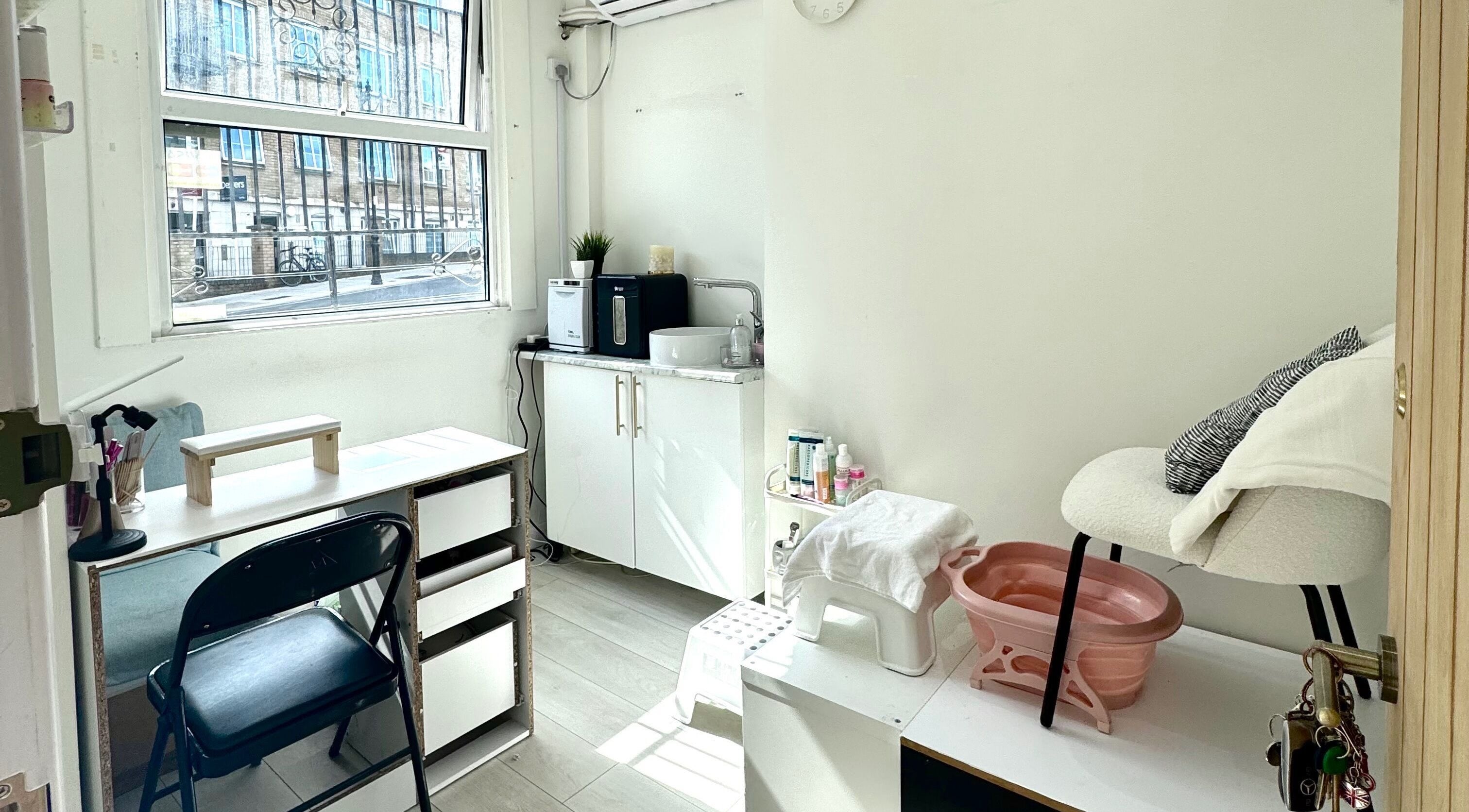 Serene beauty space at Miche in London, England, GB, featuring a manicure station and relaxing chair.