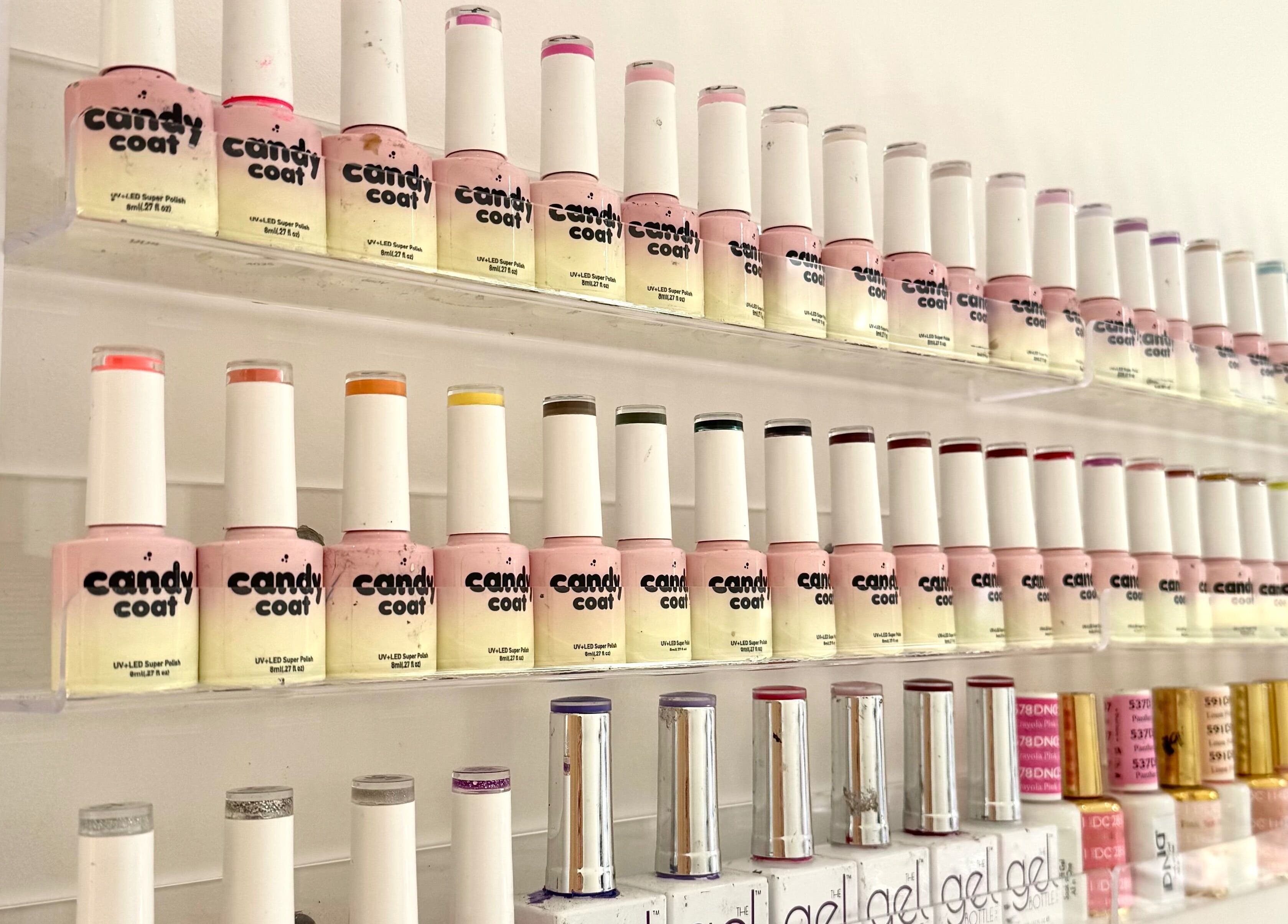 Colorful nail polish wall at Miche, London, England, GB showcasing a wide variety of shades.