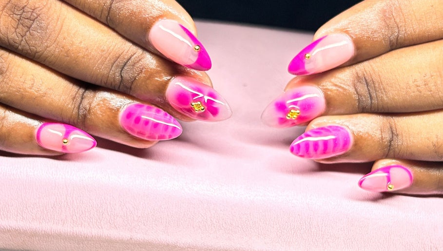 Vibrant pink nail art at The Nail Spa, Kingston, St. Andrew Parish, JM showcasing artistry and style.