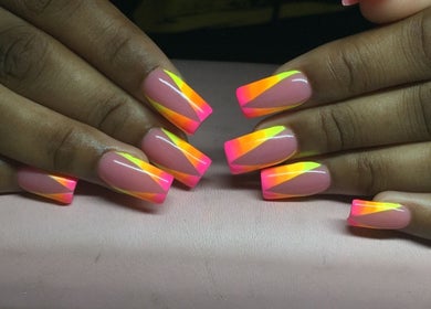 Vibrant neon nail art at The Nail Spa, Kingston, St. Andrew Parish, JM, showcasing colorful manicure skills.