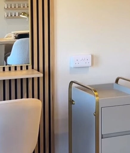 Modern salon interior at Salon Palm, Billericay, England, GB featuring sleek furniture and stylish decor.
