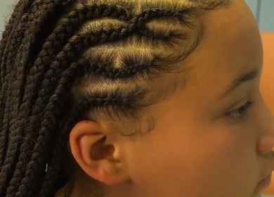 Intricate braids styled at Allure Beauty Bar, Springs, Gauteng, ZA, showcasing expert hair artistry.