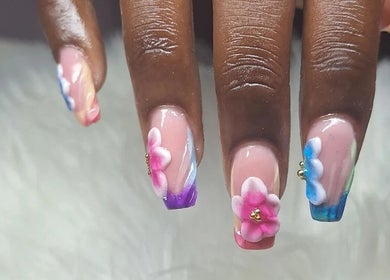 Elegant floral nail art at Rachella Creations in Oistins, Christ Church, BB. Perfect for a stylish manicure.