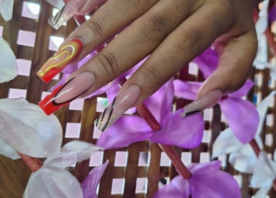 Stylish nail art design at Rachella Creations, Oistins, Christ Church, BB. Bold colors and creative patterns.