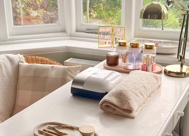 Calm beauty setup at Aura by Georgia, Lyme Regis, England, GB, featuring cozy chair and manicure tools.