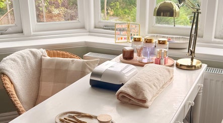 Calm beauty setup at Aura by Georgia, Lyme Regis, England, GB, featuring cozy chair and manicure tools.