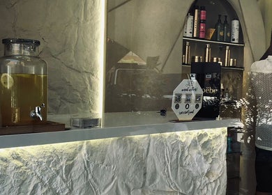 Elegant reception at Phoebe, Marrakech, Marrakech-safi, MA, featuring a stone counter and beauty products.