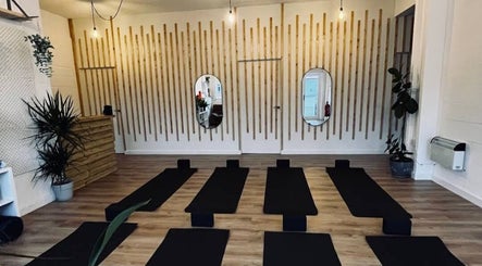 Peaceful yoga studio at Wellbeing with Lucy, Birkenhead, England, GB, featuring mats and a calming decor.