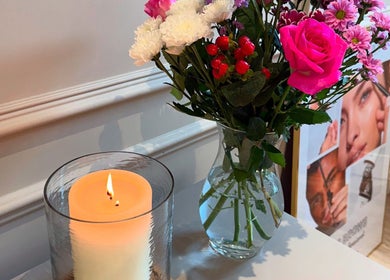 Serene setup with candle and flowers at Elmwood Health & Beauty Ltd, Kirkby In Ashfield, England, GB.