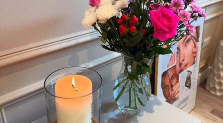 Serene setup with candle and flowers at Elmwood Health & Beauty Ltd, Kirkby In Ashfield, England, GB.