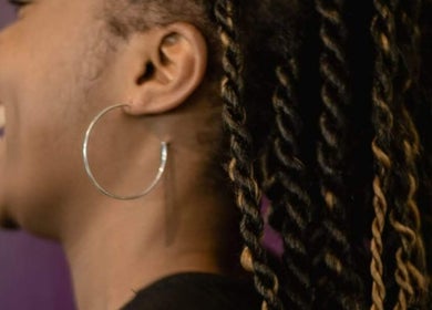 Close-up of stylish twisted hairstyle at Take Down & Detangle, Cardiff, Wales, GB.
