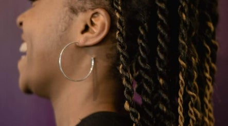 Close-up of stylish twisted hairstyle at Take Down & Detangle, Cardiff, Wales, GB.