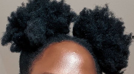 Afro puff hairstyle at Take Down & Detangle, Cardiff, Wales, GB. Perfect combination of style and texture.