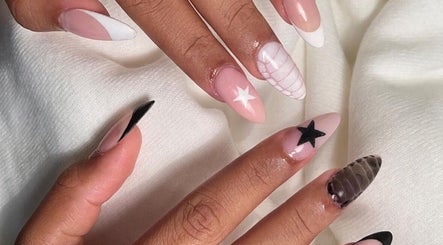 Stylish star-themed nail art at Cured in Cambridge, England, GB, showcasing intricate design details.
