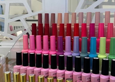 Nail polish collection at Cured, Cambridge, England, GB. Vibrant shades neatly arranged.