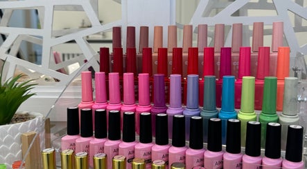Nail polish collection at Cured, Cambridge, England, GB. Vibrant shades neatly arranged.