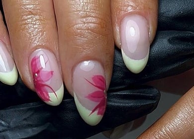 Elegant floral nail art by HT Studio in Glasgow, Scotland, GB, showcasing delicate pink designs on manicured nails.