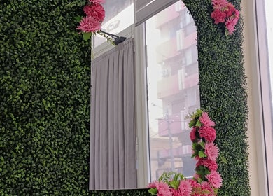 Greenery and pink flower mirror at Beauty Atelier by Zeinaa, Tarablus, North Governorate, LB.