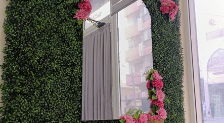Greenery and pink flower mirror at Beauty Atelier by Zeinaa, Tarablus, North Governorate, LB.