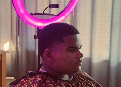 Client with a fresh fade under salon lights at Faded By Emmy, Cape Town, Western Cape, ZA.