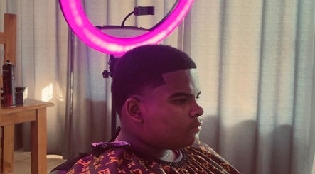 Client with a fresh fade under salon lights at Faded By Emmy, Cape Town, Western Cape, ZA.