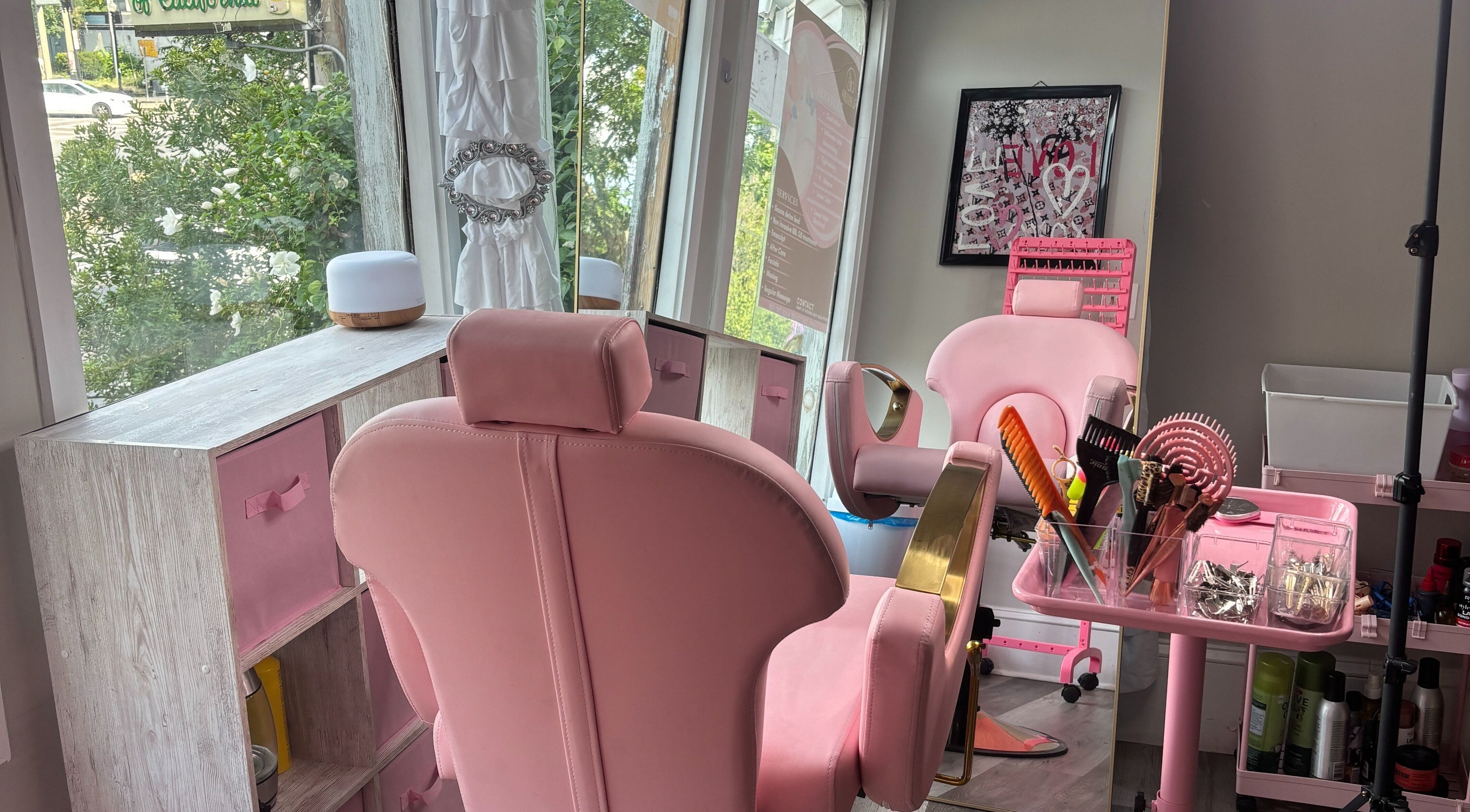 Stylish pink salon chairs at Slayed By Becca in Boston, Massachusetts, US, offering a luxurious beauty experience.