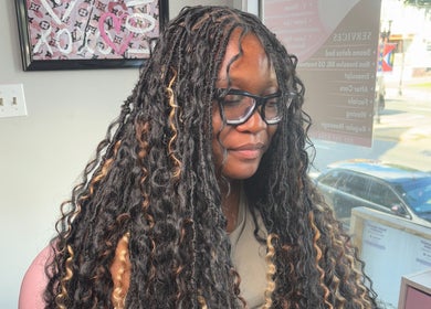 Client with luxurious twisted hairstyle at Slayed By Becca, Boston, Massachusetts, US.