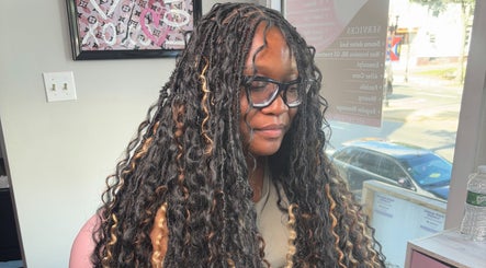 Client with luxurious twisted hairstyle at Slayed By Becca, Boston, Massachusetts, US.