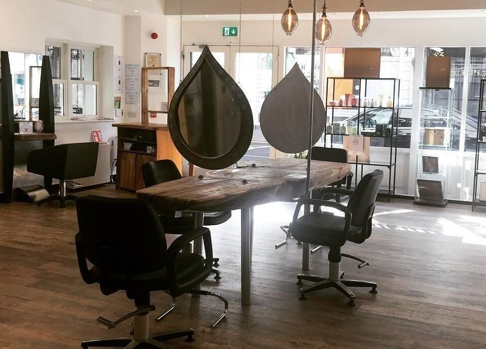 Chic styling area with rustic wood table at Hairology, Carlow, County Carlow, IE.