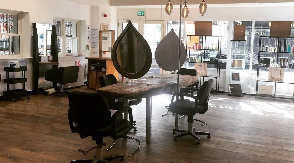 Chic styling area with rustic wood table at Hairology, Carlow, County Carlow, IE.