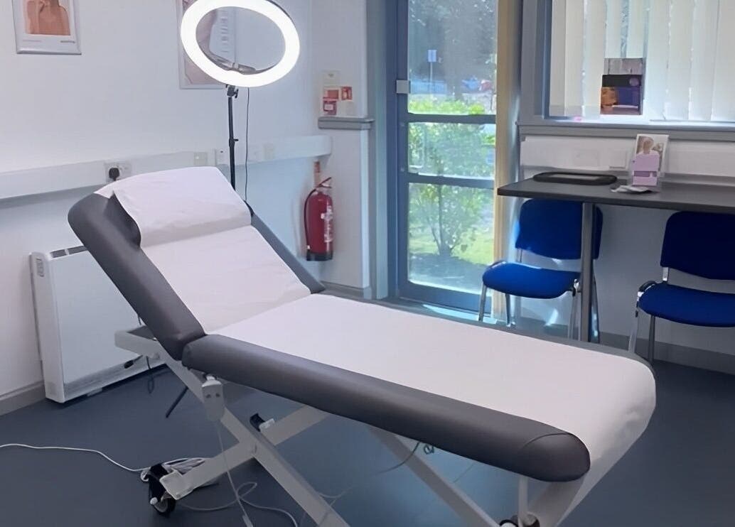 Modern treatment room at RTB Aesthetics, Cardiff, Wales, GB, featuring a professional massage bed and well-lit interior.