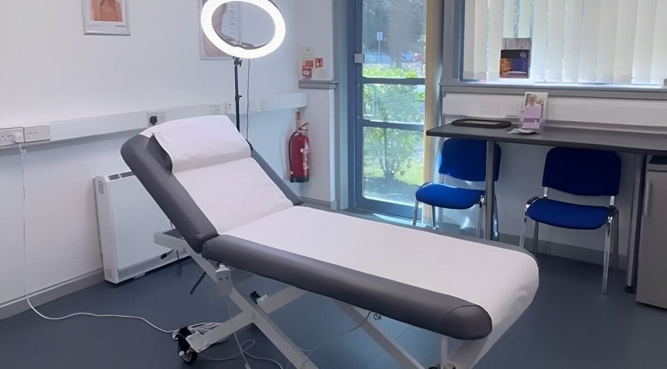 Modern treatment room at RTB Aesthetics, Cardiff, Wales, GB, featuring a professional massage bed and well-lit interior.