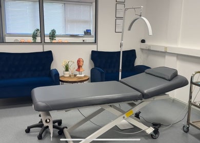 RTB Aesthetics treatment room with luxury sofa and medical bed, Cardiff, Wales, GB.