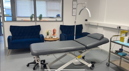 RTB Aesthetics treatment room with luxury sofa and medical bed, Cardiff, Wales, GB.