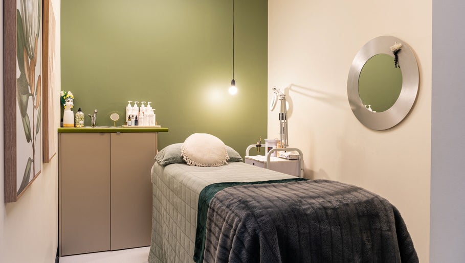 Cozy treatment room at Sharkra Medi Spa & Laser Clinic, Hobart, Tasmania, AU, featuring a plush bed and serene decor.