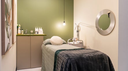 Cozy treatment room at Sharkra Medi Spa & Laser Clinic, Hobart, Tasmania, AU, featuring a plush bed and serene decor.